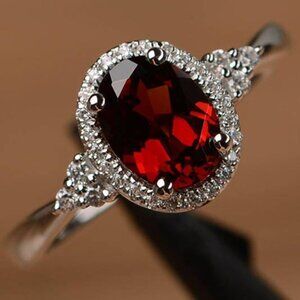 Oval Garnet and Moissanite Halo Ring in Sterling Silver